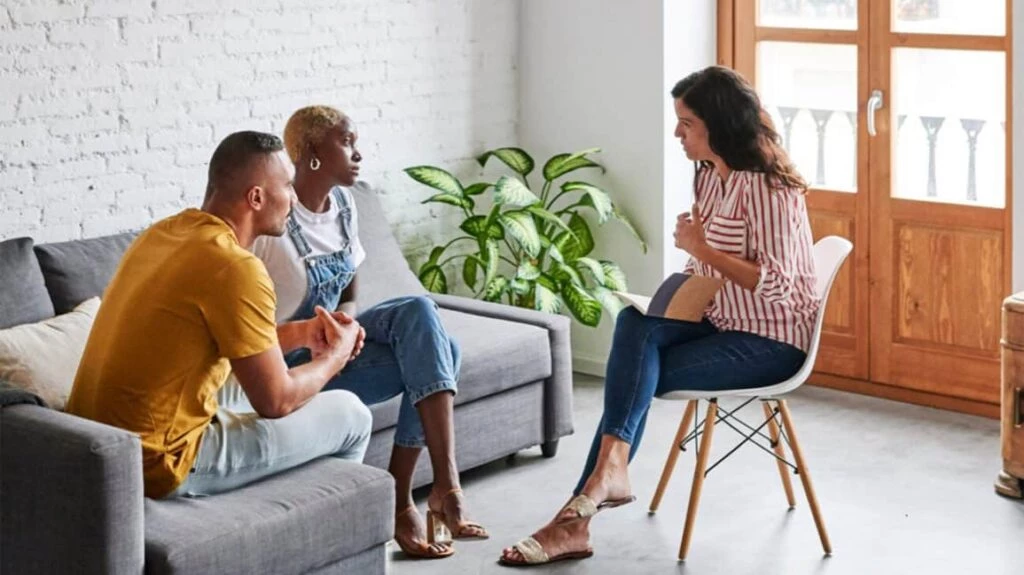 18 Signs You and Your Partner Need Couples Counseling Now Couple During Counseling